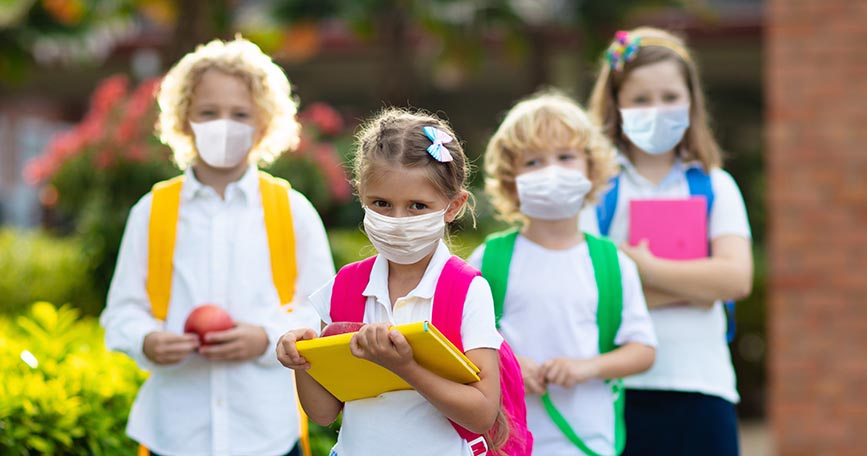 School child wearing face mask. Virus outbreak.